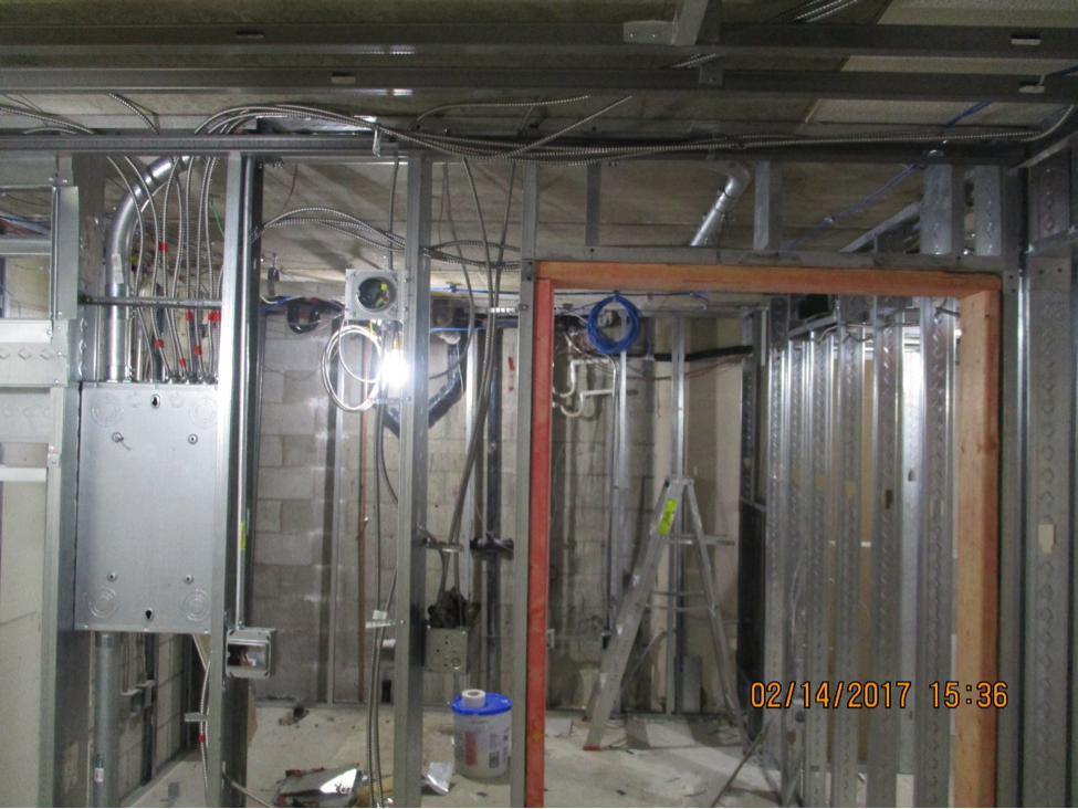Room under construction without dry wall has exposed metal frames