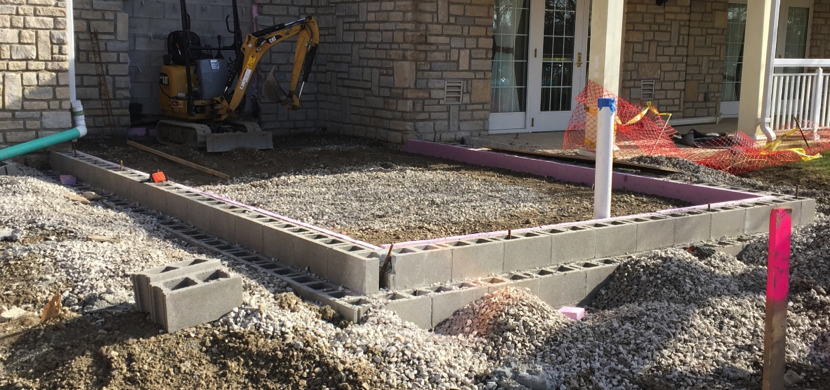 Outside view of future site base of foundation in place