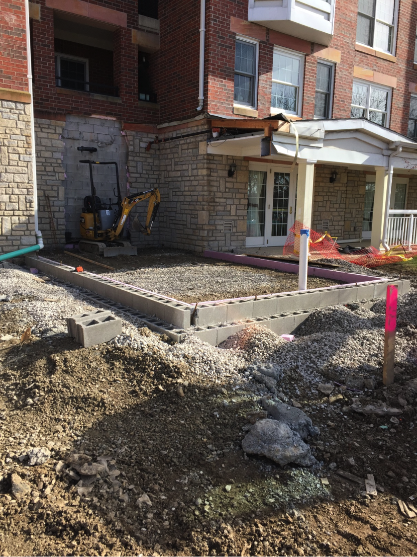 Outside view of future site base of foundation in place