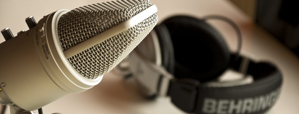 microphone and headphones sitting on a table