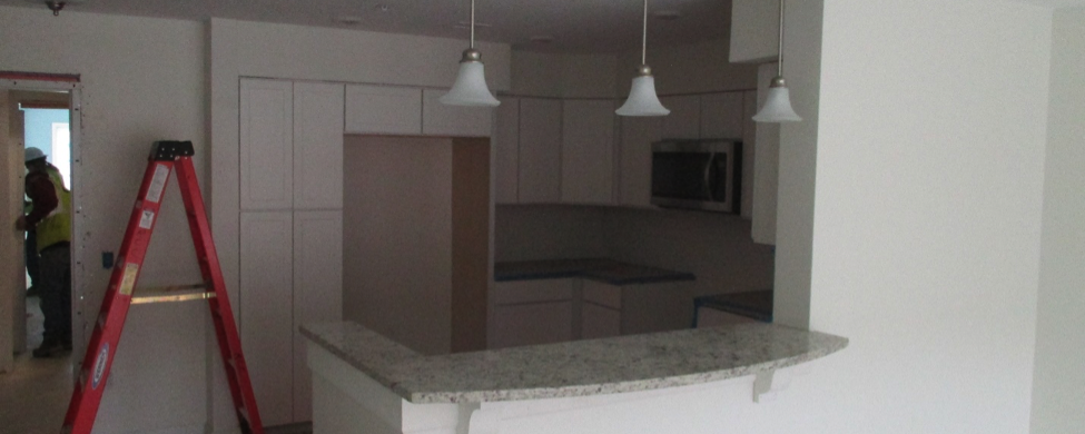Construction at Riverstone shows ladder in kitchen area
