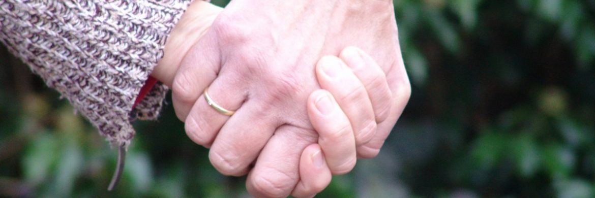 couple holding hands outside