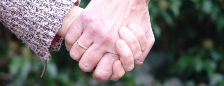 couple holding hands outside