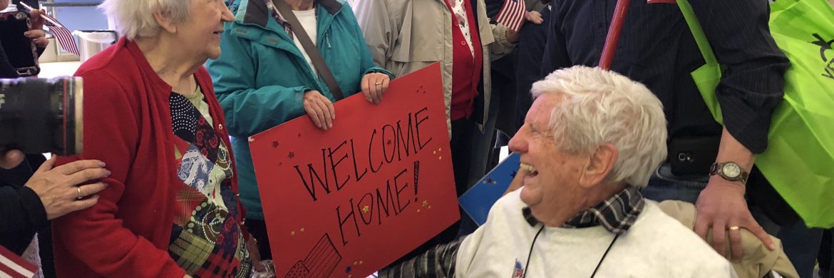 Honoring residents who served our country with signs and flags