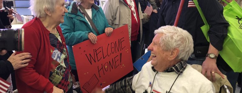 Honoring residents who served our country with signs and flags
