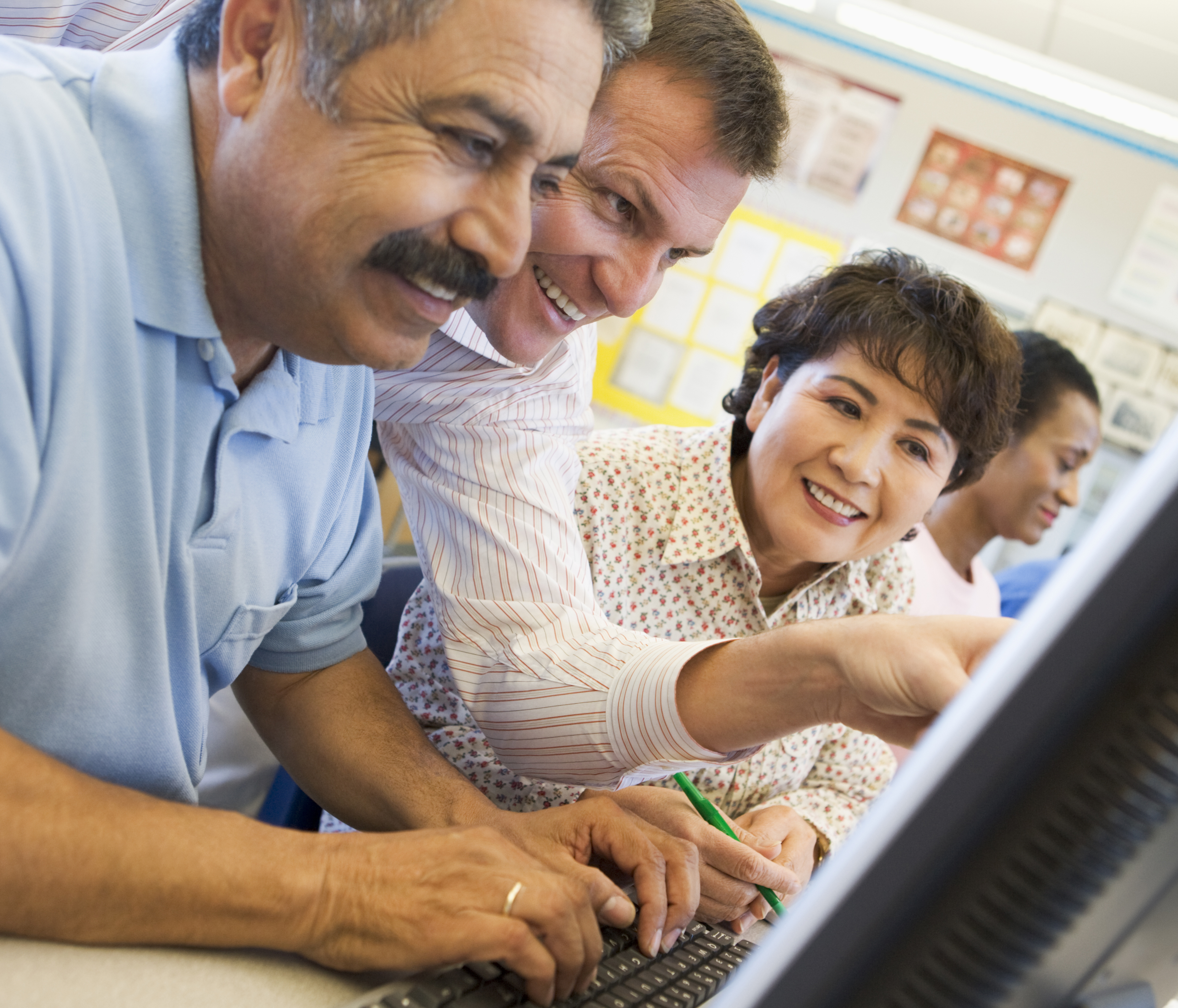 Seniors learning at computer