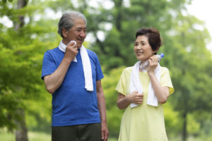 Asian couple exercising for physical wellness