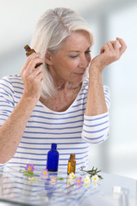 woman samples aromatherapy oils