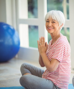 senior woman practicing yoga