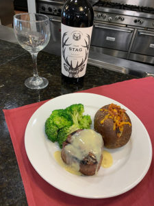 nutritious meal of steak, broccoli and potato with wine
