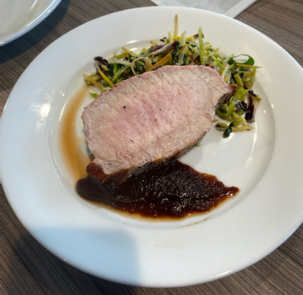 Riverwalk restaurant pork loin with sauce on the side.
