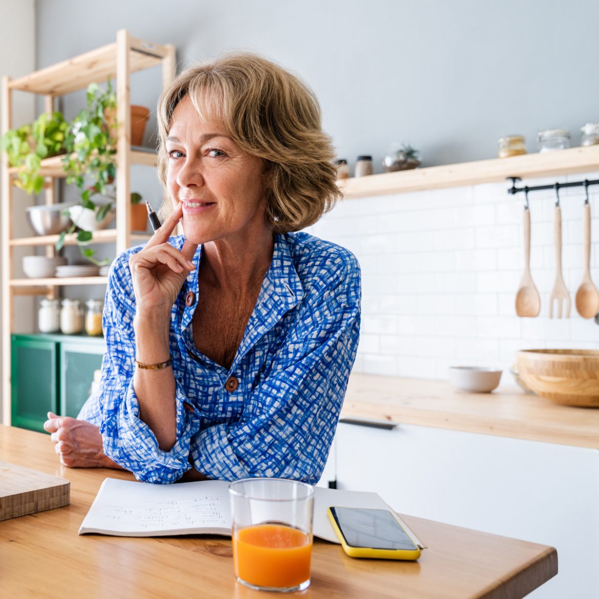 woman making a list of what she wants in a senior living community