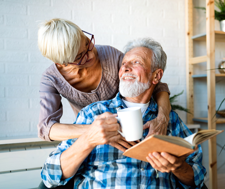 senior couple embracing in memory care