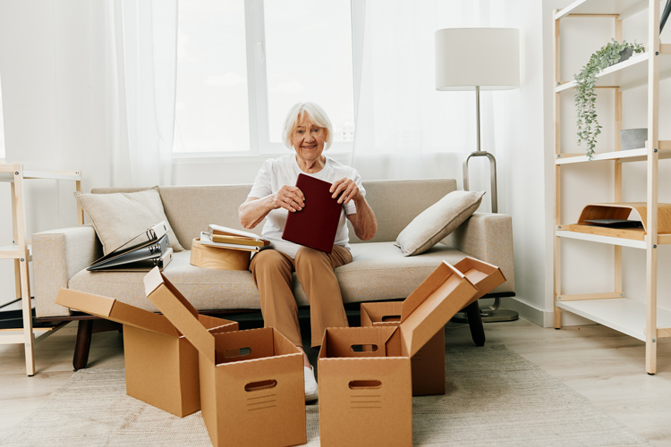 Older woman with moving boxes
