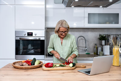 Senior woman preparing food.