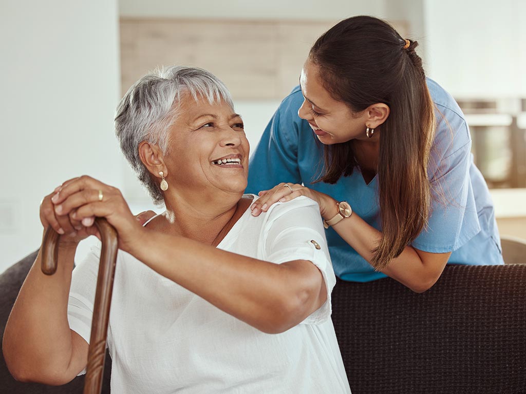 Nurse with older adult in senior living community