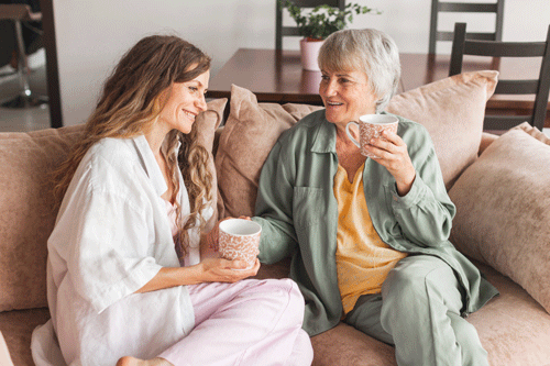 Older women conversing on couch