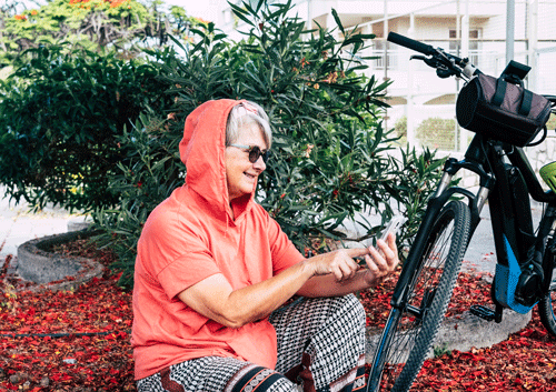 older woman with bicycle