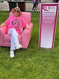 Resident Lorita M. relaxes in a chair after the Race for the Cure