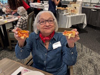 Enjoying Chicago-style deep dish pizza at Active Aging Week