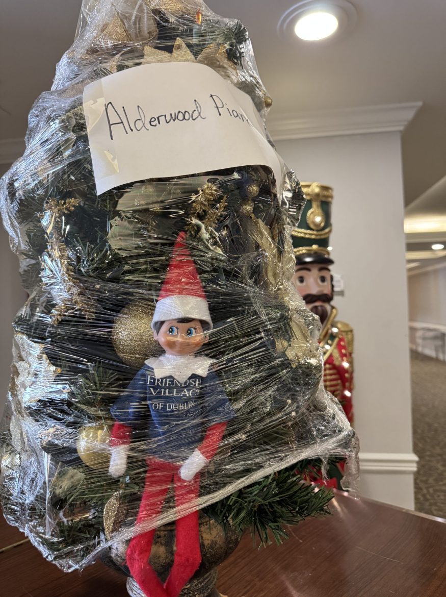 Friendly the Elf gets shrink wrapped in the decorations at Friendship Village of Dublin.