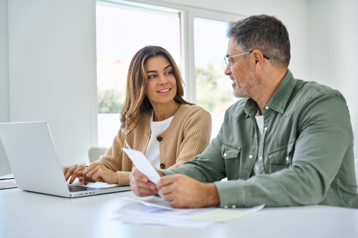 Older man discussing senior living options with his daughter