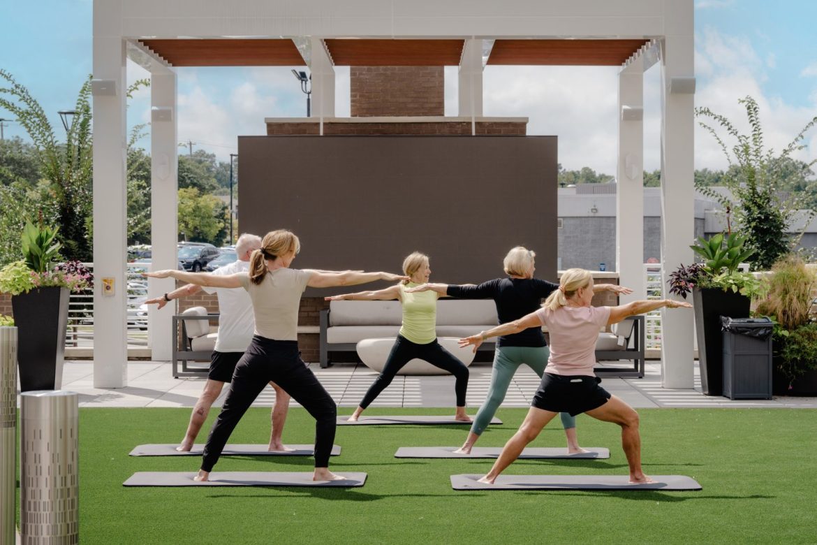 Bailey Residents enjoying yoga on the outdoor activities deck