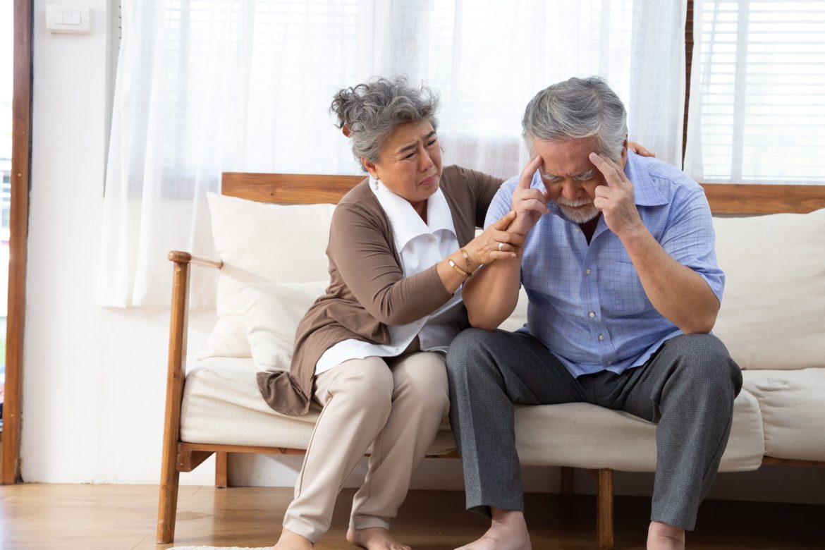 A woman comforts a man living with dementia.