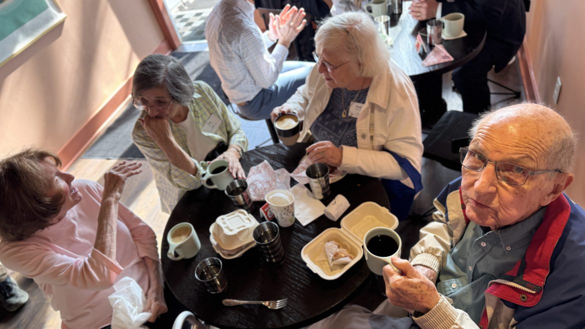Residents enjoy coffee and donuts.
