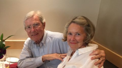 Jim Hamilton sits with his arm around his wife, Merry.