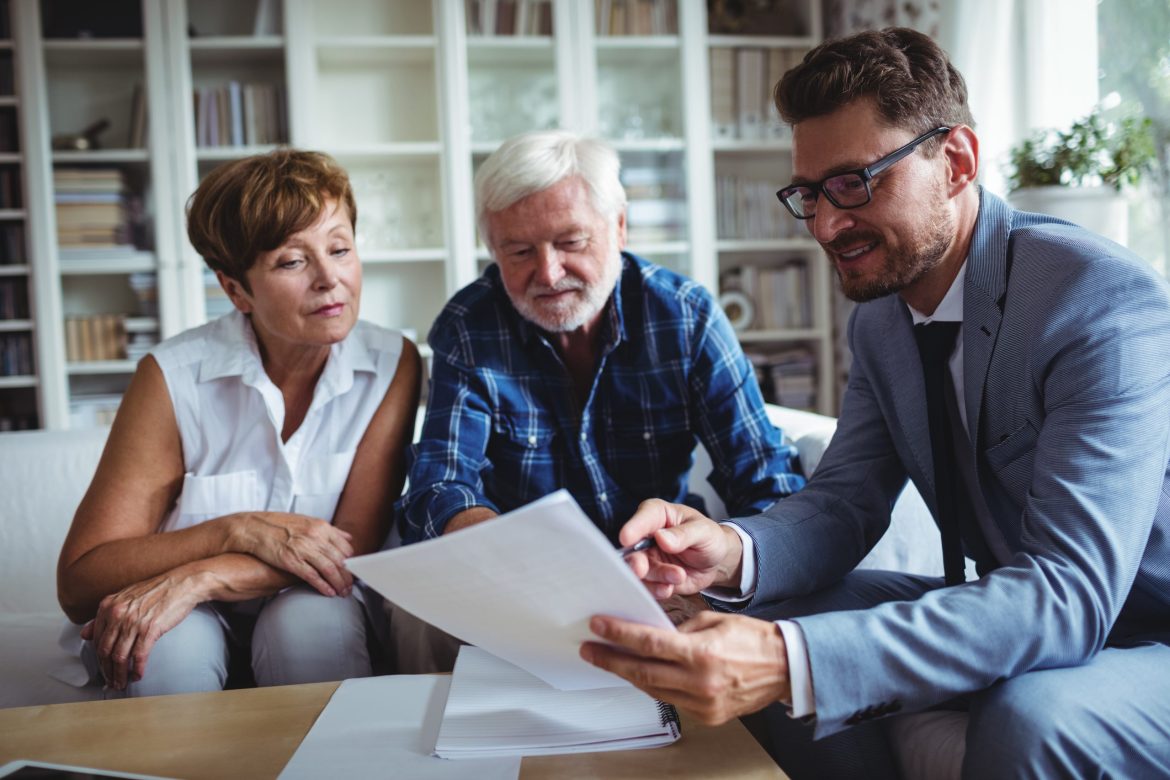 Older couple meets with senior living lifestyle counselor.