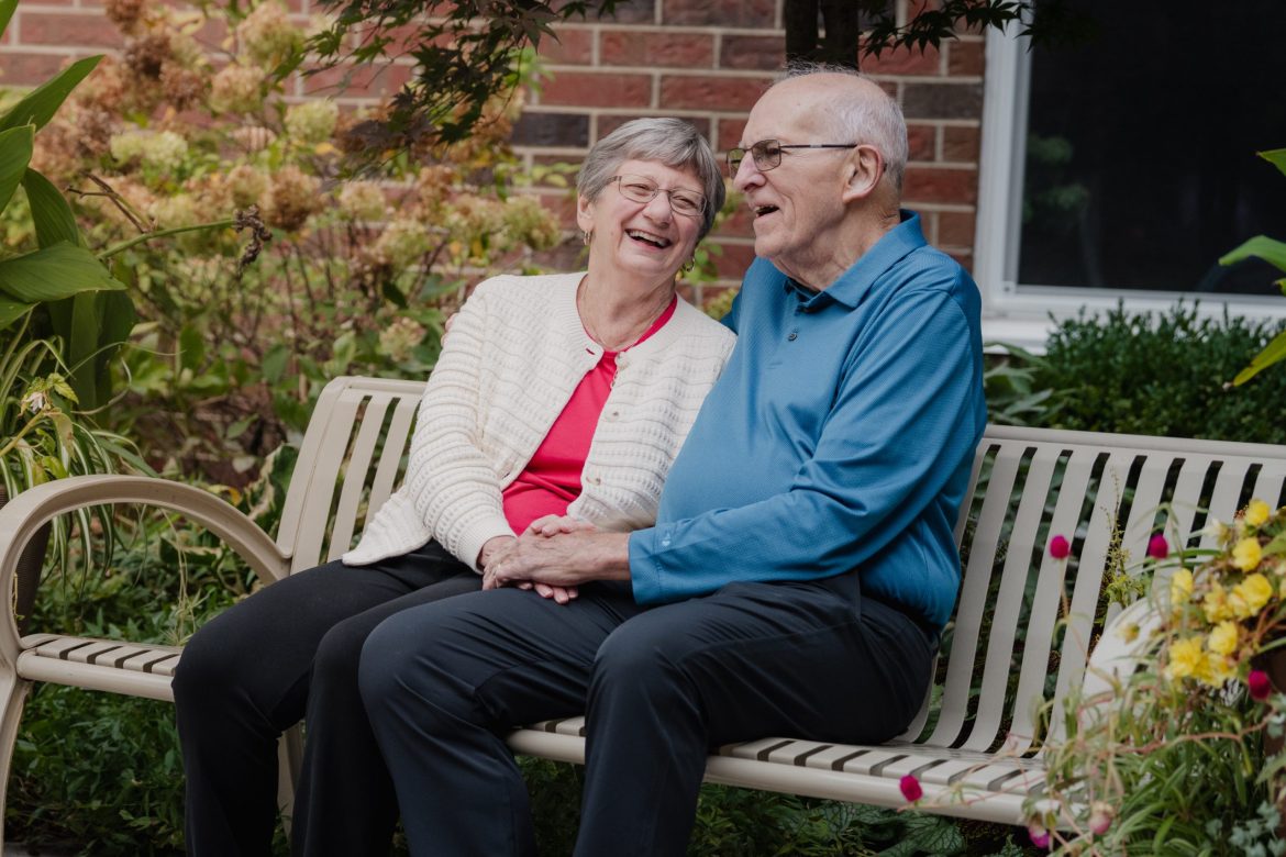 Couple sitting on a bench at Friendship Village of Dublin.
