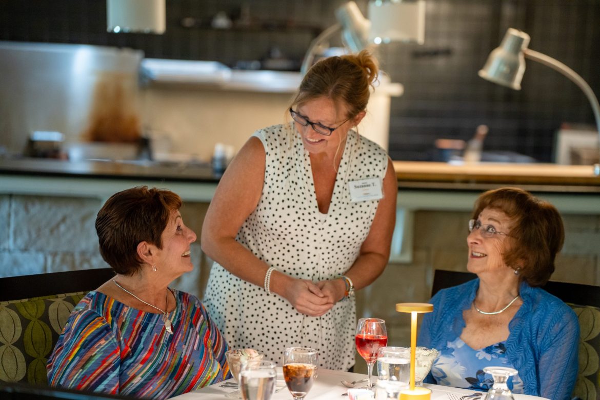 A server waits on Residents dining at Friendship Village of Dublin.