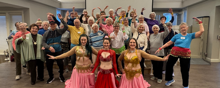 The residents of FVD take a group photo with their trio of local belly dancing instructors, who came to teach the group during Active Aging Week.